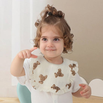 Bavoir bébé coton brodé avec motif mignon et design élégant, parfait pour les repas.